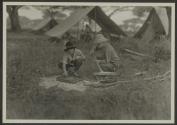 Osa Johnson and George Eastman baking bread in Dutch Oven, African Safari