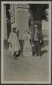 George Eastman and native man beside Kodak Girl standup advertisement, African Safari