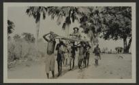 Osa Johnson being carried in sedan chair, African Safari