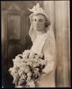 [Bride holding bouquet]