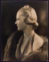 [Woman wearing fur stole]