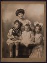 [Woman and three children]