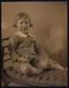 [Child holding a ball]