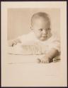 [Baby with rattle]