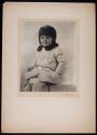 [Child in hat and coat]