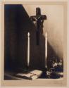 [Crucifix and candles]
