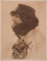 [Woman in hat with veil]