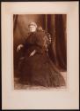 [Seated woman]