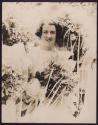 [Woman holding bouquet]
