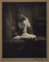 [Seated nude woman draped in cloth]