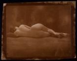 [Nude woman laying on side]