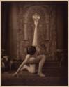 [Posed nude woman holding orb]