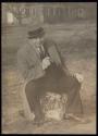 [Elias Goldensky sitting on rock]