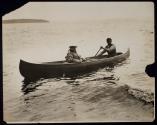 [Elias Goldensky and man in canoe]