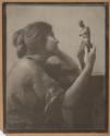 [Portrait of a woman with statuette]
