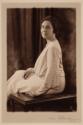 [Seated woman]