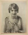 [Woman wearing jewelry]