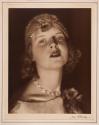 [Woman wearing cap]