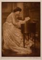 [Woman at a desk]