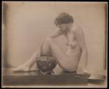 [Seated nude woman with ceramic]