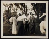 [Elias Goldensky and others outside]