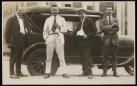 [Elias Goldensky and three men in front of car]