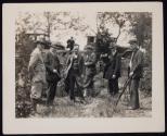 [Elias Goldensky (second on left), holding a camera standing with six other men, some with cameras]
