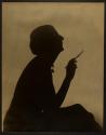 [Figure in profile with cigarette]