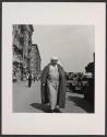 [Woman in religious garb on street]