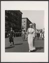[Woman in religious garb in parade]