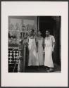 [Three butchers outside shop]