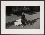 [Boy on Ticycle]
