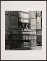 [Woman & dog looking out window]