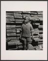 [Boy in front of planks]