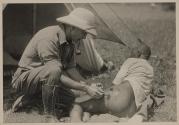 Dr. Audley Stewart attending to wounds, African Safari