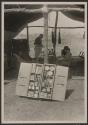 George Eastman and Osa Johnson at dining table in tent, African Safari