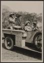 Osa Johnson driving automobile with mounted motion picture camera, African Safari