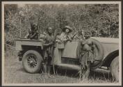 Natives posing with Osa Johnson and automobile, African Safari
