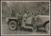 Natives posing with Osa Johnson and automobile, African Safari