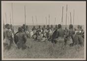 Osa Johnson and Dan Pomeroy examining dead lion, African Safari