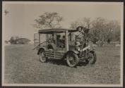 Johnsons with automobile with mounted motion picture camera, African Safari