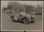 Osa Johnson driving automobile with mounted motion picture camera, African Safari