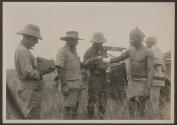 George Eastman photographing Audley Stewart attending to wound, African Safari