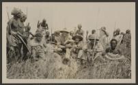 Carl Akeley, hunters and native tribesmen with dead rhino, African Safari