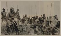 Hunters and native tribesmen with dead rhino, African Safari