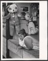 [Woman in game booth in Coney Island]