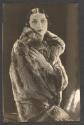 Lillian Fischer, Fashion Editor of Vogue wearing chinchilla cape from Weil with jewels from Boucheron