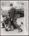 Boston police pin a tenants' group worker down