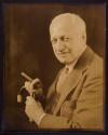 [Man with cigar and cane]