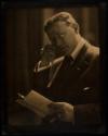 [Man reading]